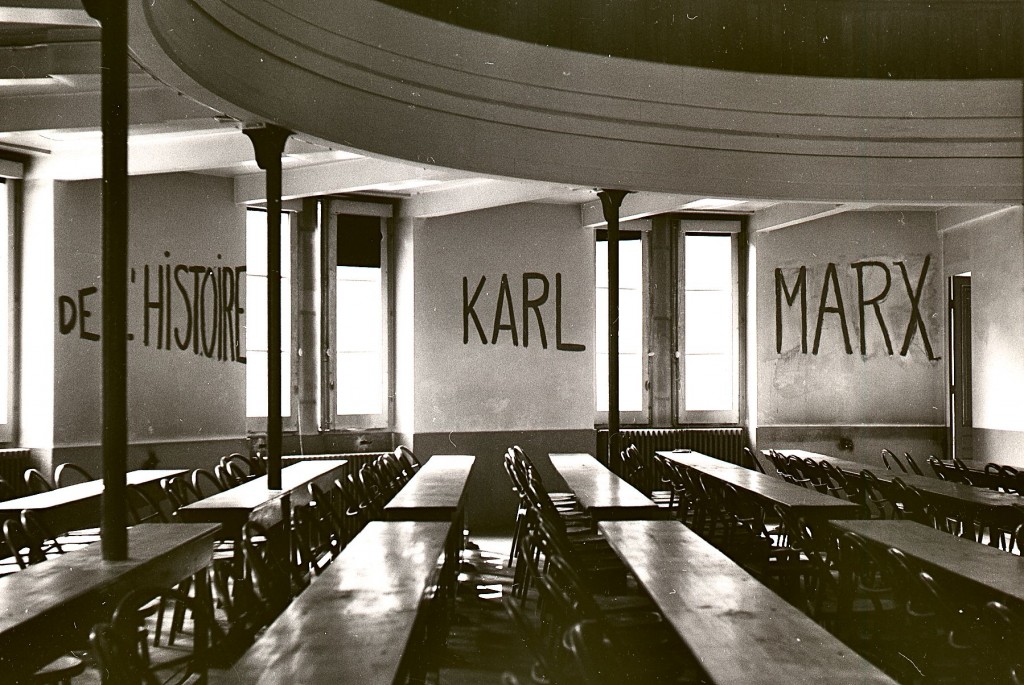 Classroom at the University of Lyon with markings on wall reading "DE L'HISTOIRE KARL MARX," made during student occupation of parts of the campus as part of the May 1968 events in France.