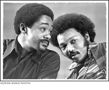 Bobby Seale, left, co-founder of the Black Panther Party, and Jesse Jackson, right, future two-time candidate for the Democratic presidential nomination, talk on March 12, 1972 at the National Black Political Convention in Gary, Indiana.