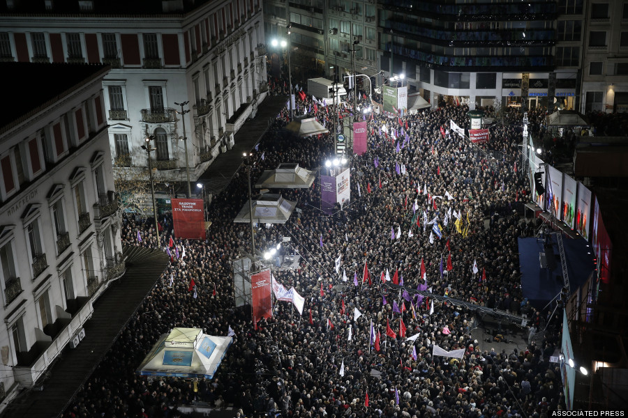 Supporters of Alexis Tsipras, leader of Greece's Syriza left-wing main opposition party attend his pre-election speech at Omonia Square in Athens on Thursday, Jan. 22, 2015. Prime Minister Antonis Samaras' New Democracy party has failed so far to overcome a gap in opinion polls with the anti-bailout Syriza party ahead of the Jan. 25 general election. (AP Photo/Petros Giannakouris)